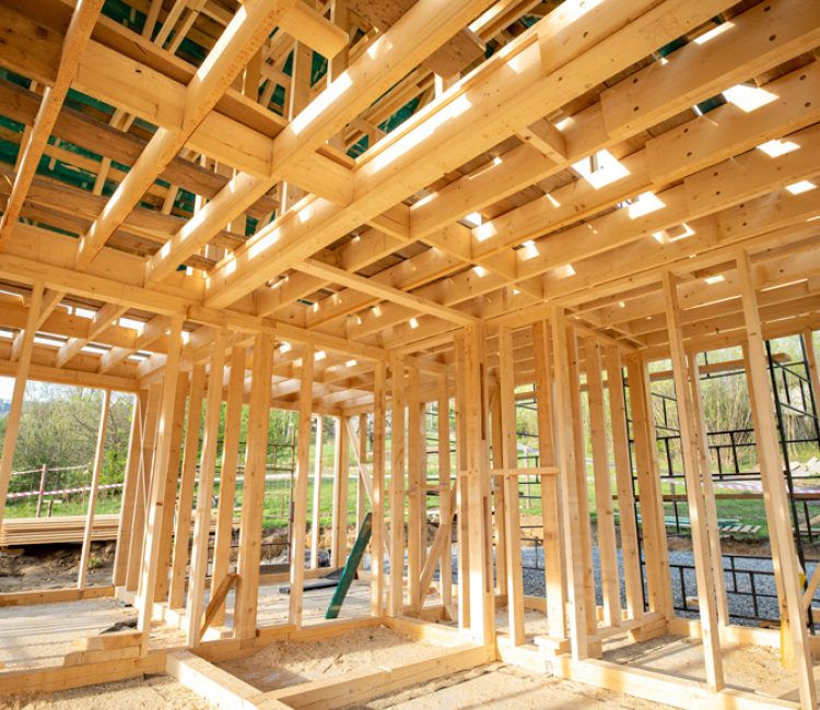 Interior of an in-construction residential house showing the wooden structure.