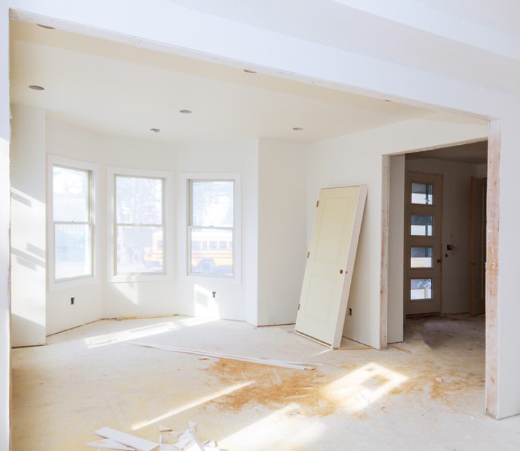In-construction residential house showing the interior with drywall placed